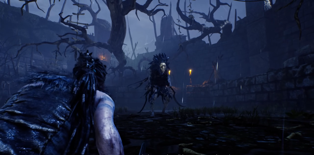 Сенуа из Hellblade сражается с монстром в руинах