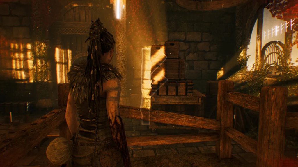 Сенуа из Hellblade стоит в каменной комнате