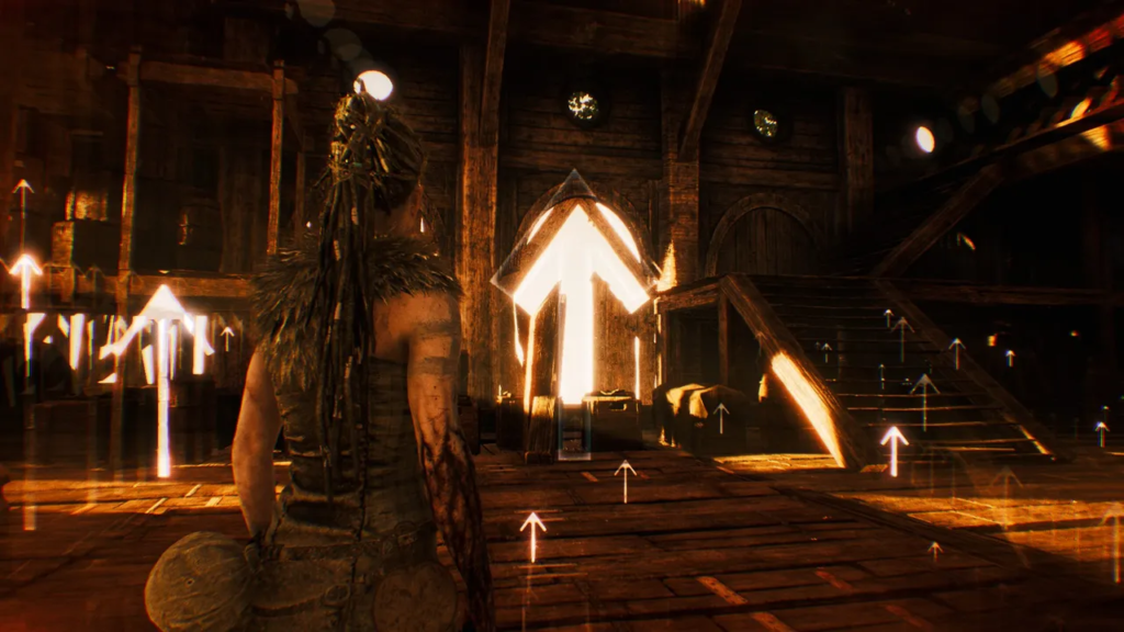 Сенуа из Hellblade стоит в деревянном зале