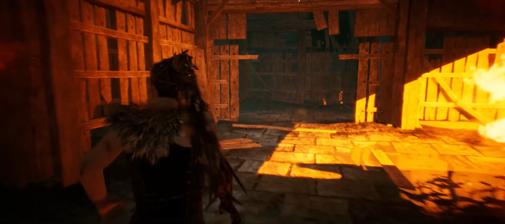 Сенуа бежит по деревянному сараю в Hellblade