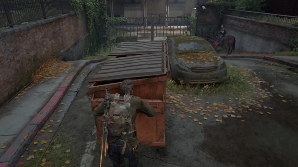 Джоэл толкает контейнер на заброшенной улице The Last of Us