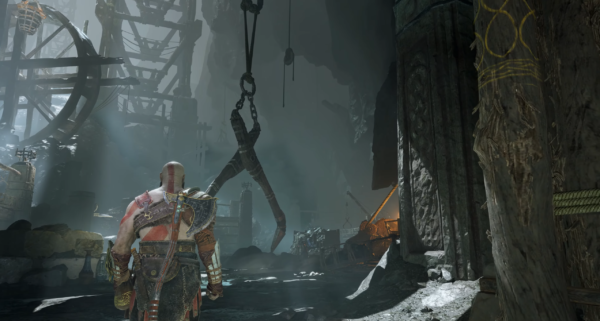 Кратос идет по пещере в God of War