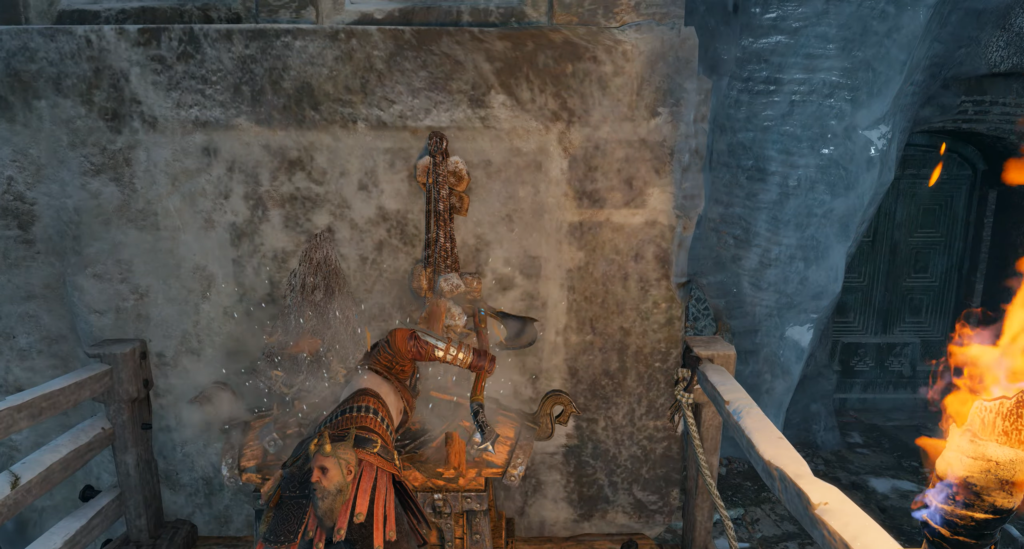 Bald mannequin raising metal bar in rocky forest