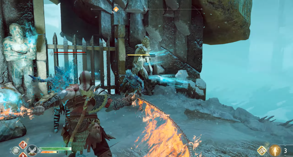 Кратос с огненным клинком сражается на снегу God of War