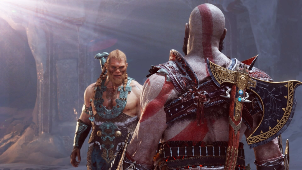 Кратос из God of War стоит перед Тором в пещере