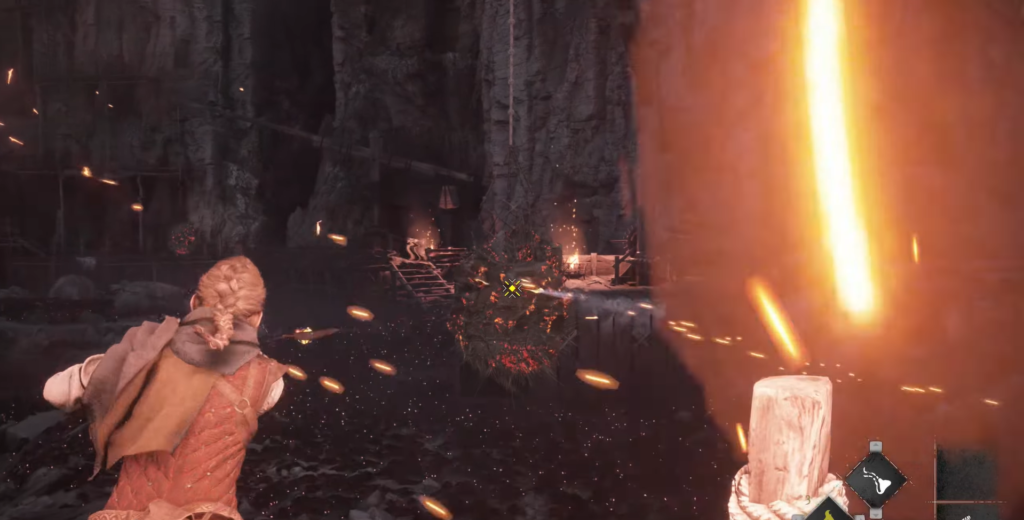 Амиция стреляет из пращи в пещере A Plague Tale