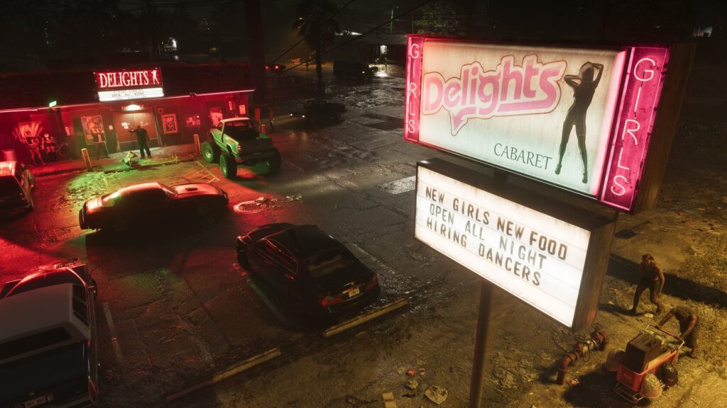 Неоновая вывеска Delights Girls у ночного клуба ночью
