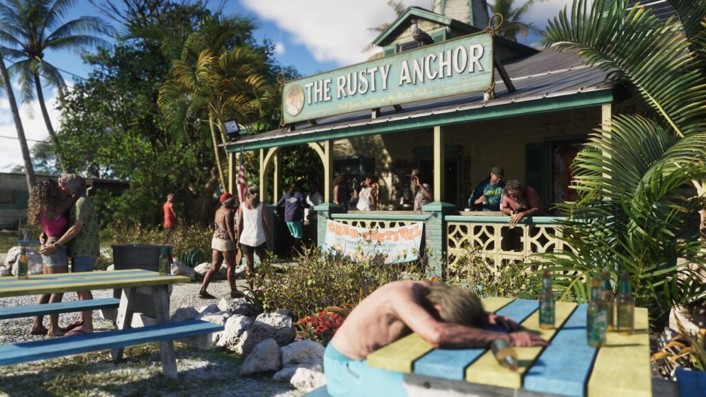 Люди отдыхают у бара The Rusty Anchor среди пальм